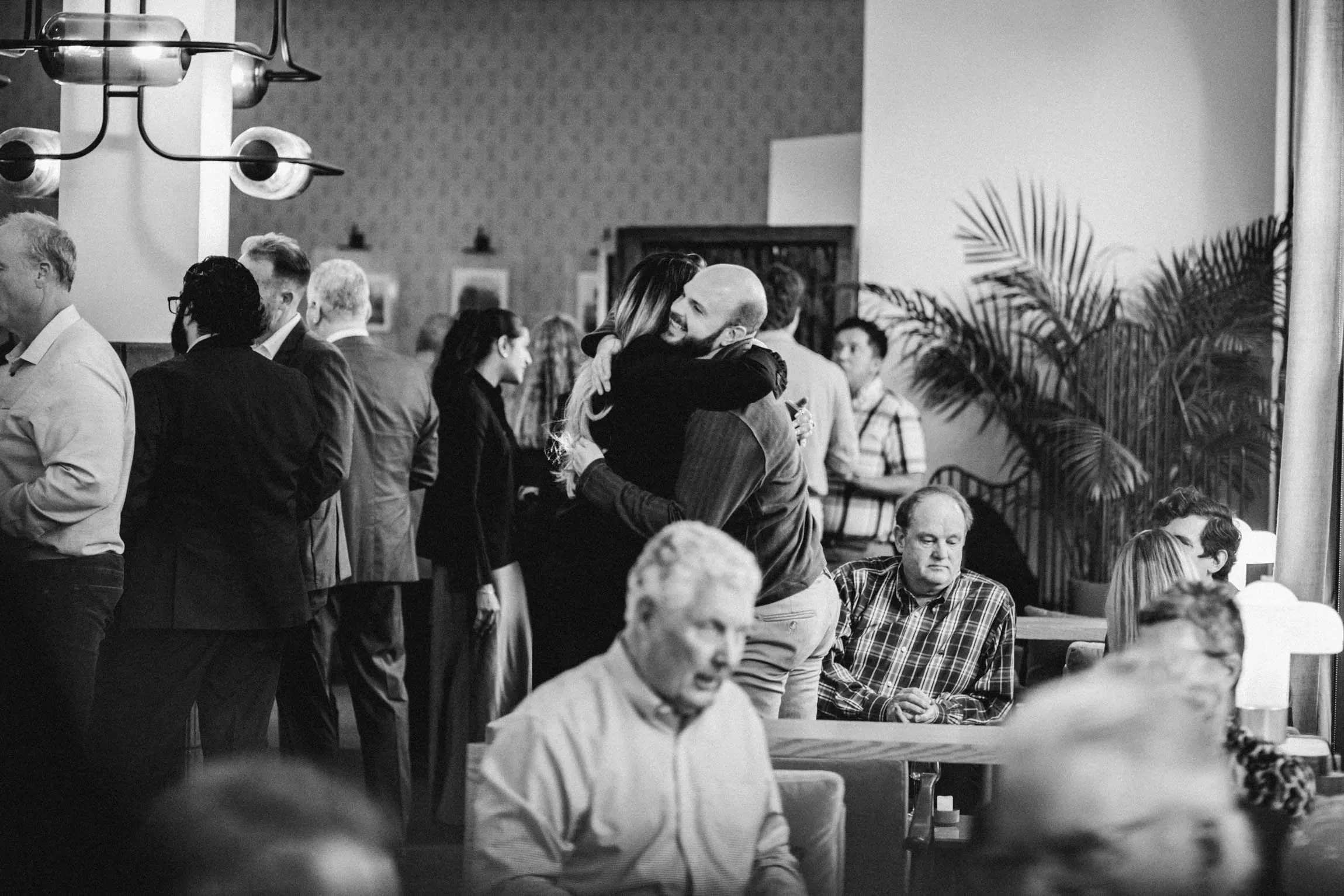 Men Smiling at Dinner Table